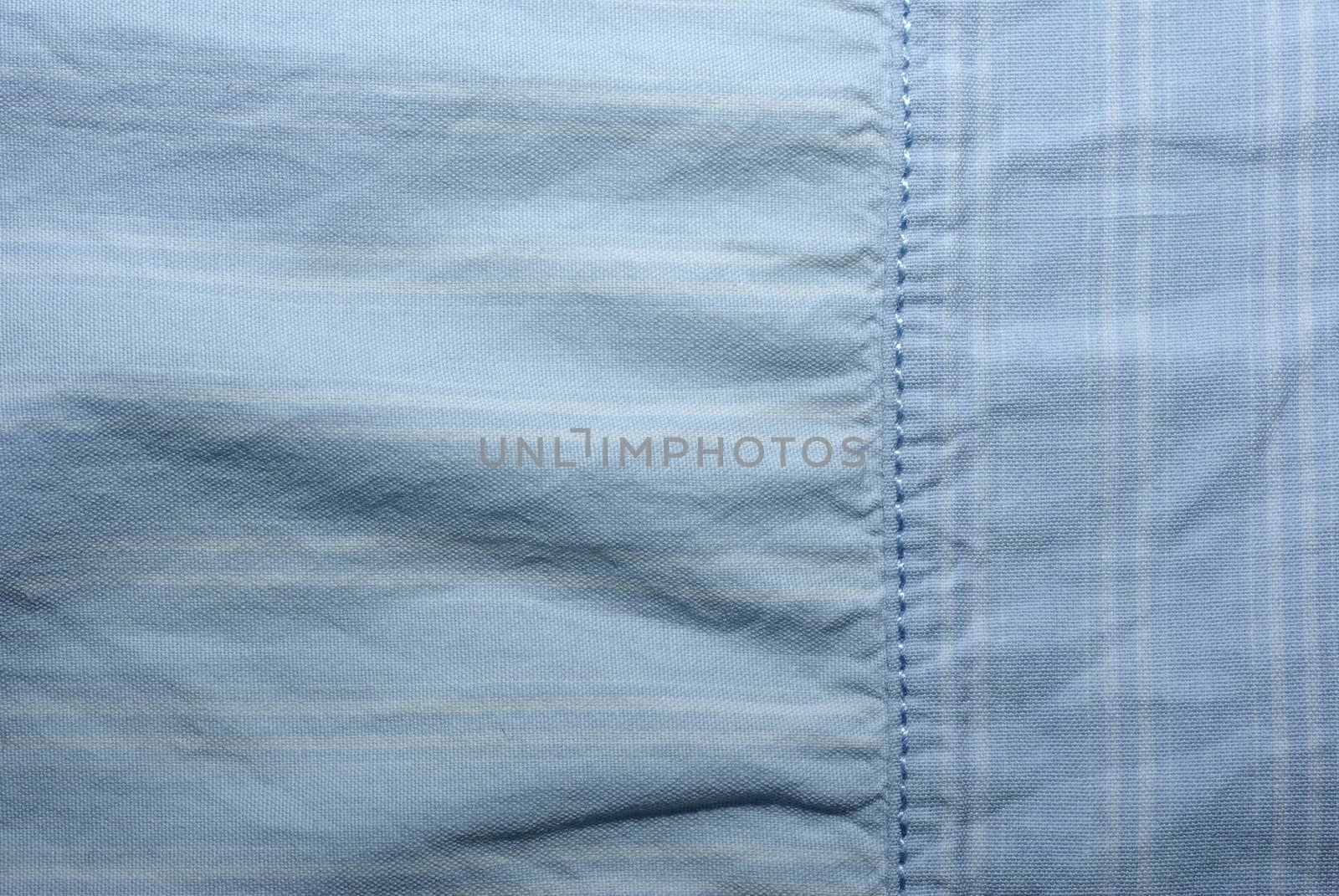 Blue abstract textured textile pattern. Use as background or backdrop.