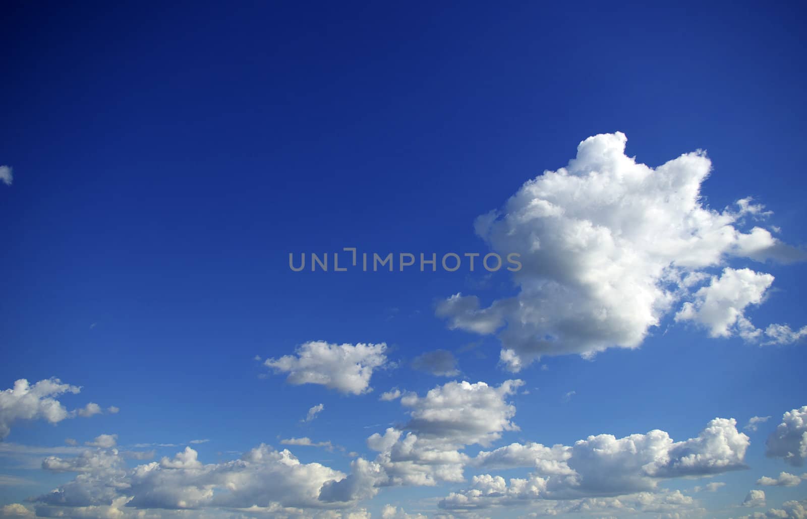 blue sky background with tiny clouds