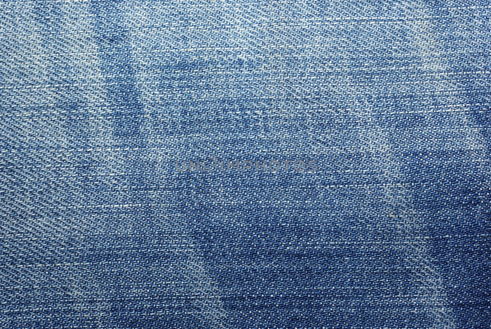 Blue worn jeans cloth textured abstract background. by borodaev