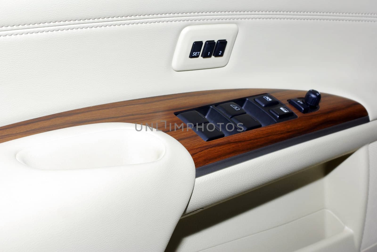 Door of modern japanese car.Wood, leather, plastic buttons. Lot  by borodaev