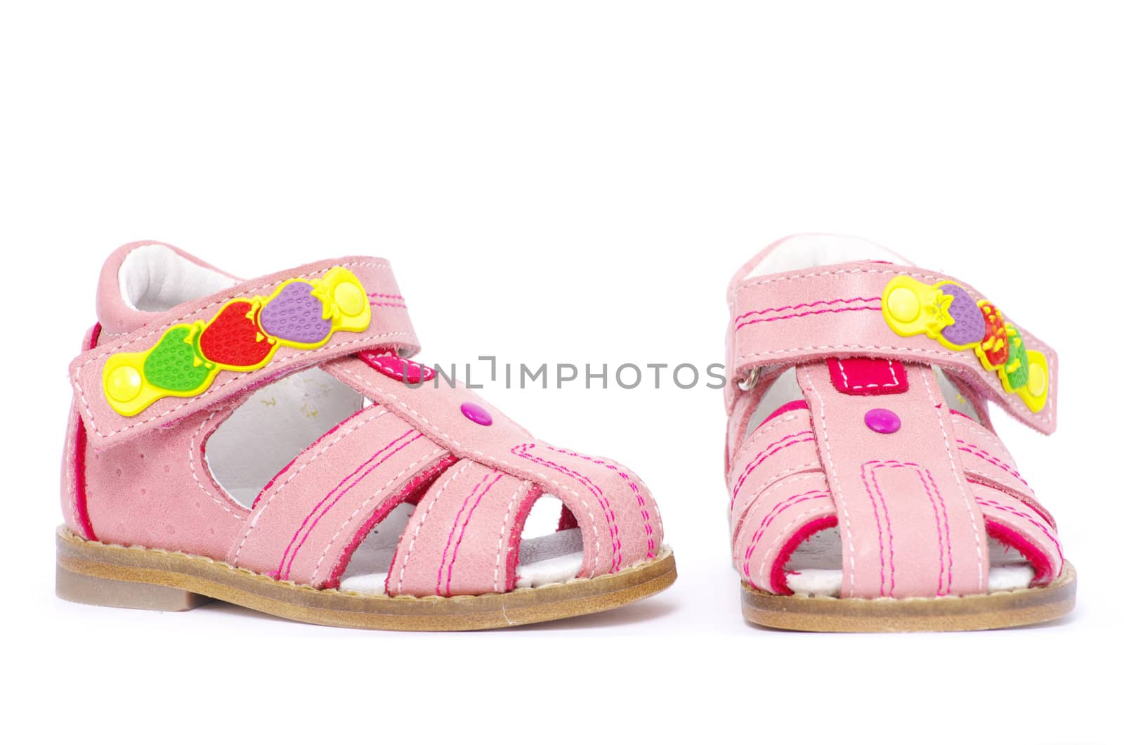 pink child's sandals isolated on white