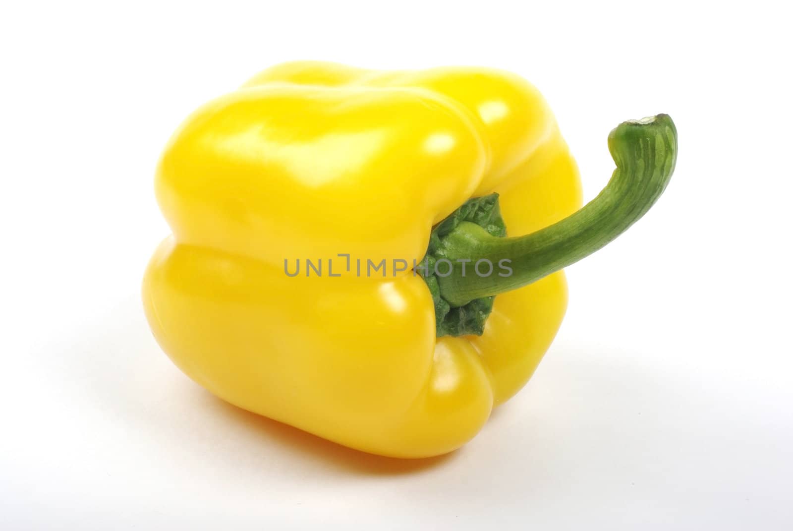 Yellow bell pepper isolated on white background with shadow.