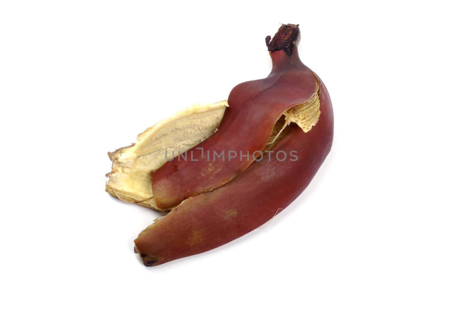 Red banana peel isolated on the white background.
