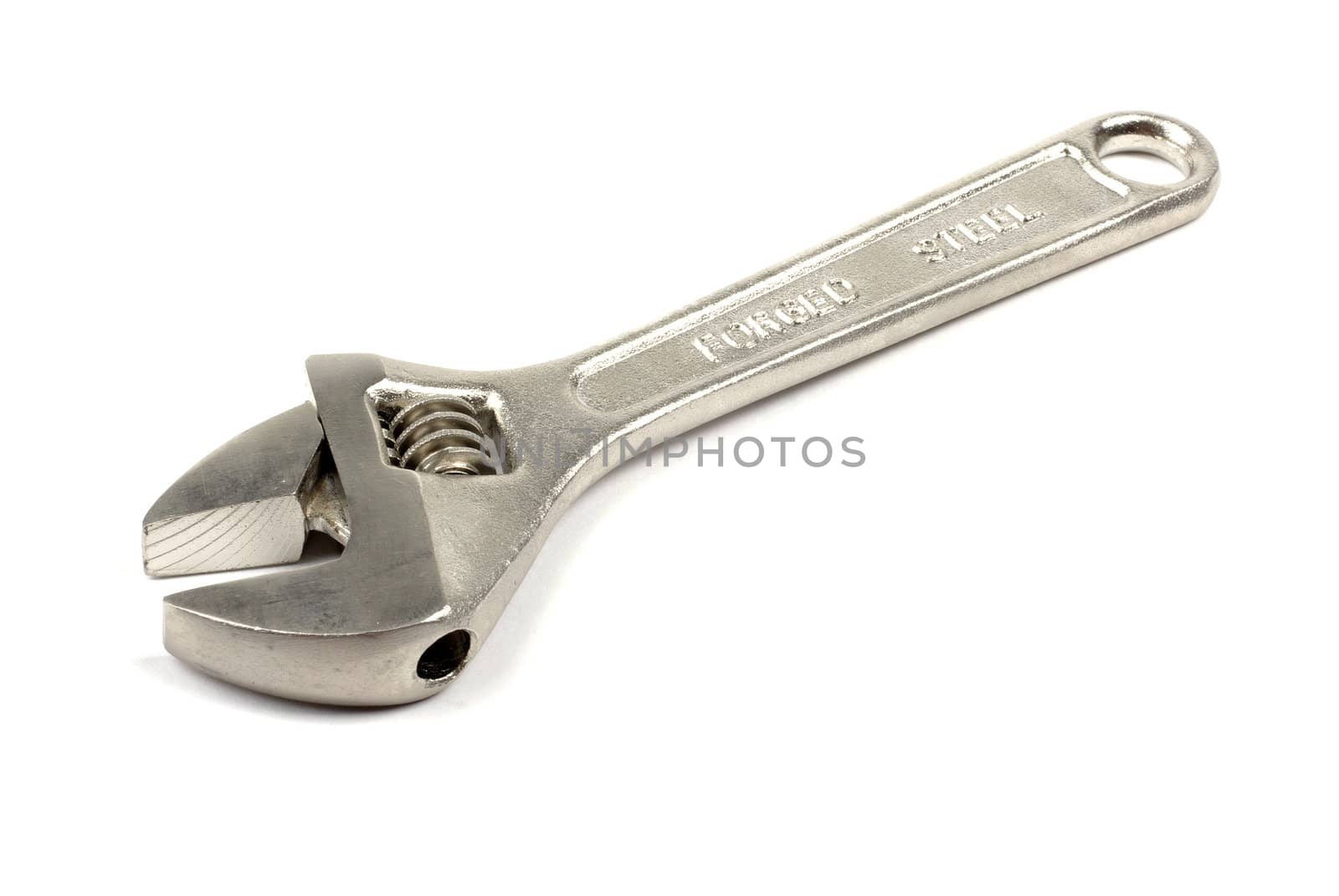 Adjustable metal wrench isolated on the white background. by borodaev