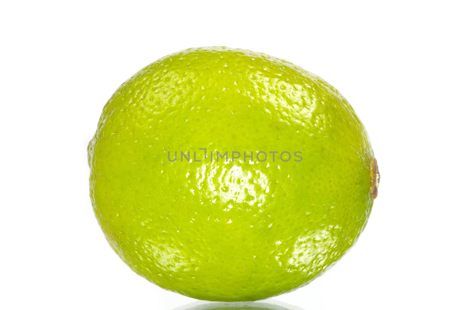 Fresh ripe lime isolated on white background