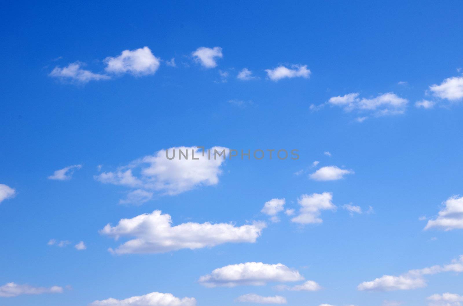 blue sky background with tiny clouds