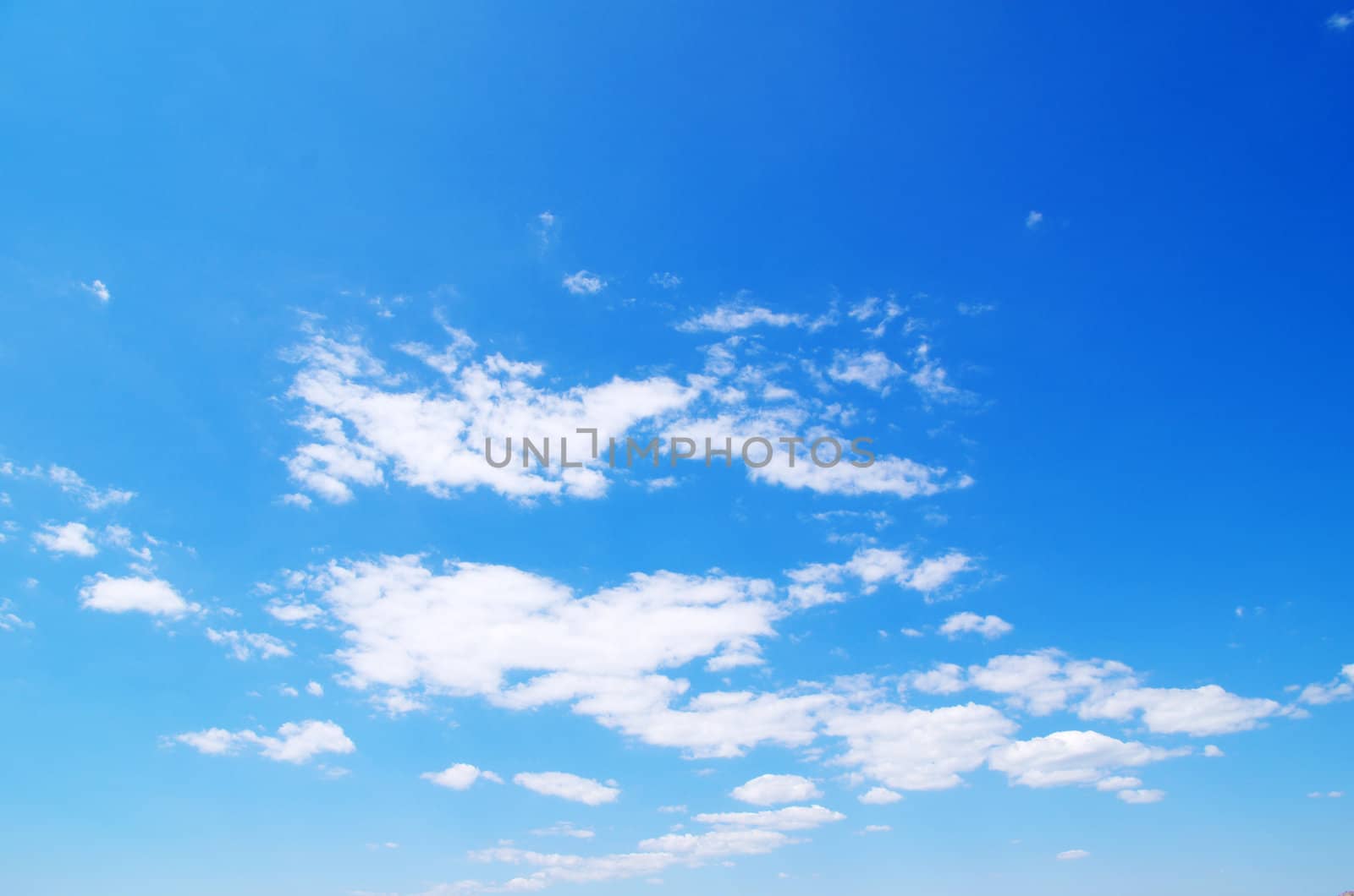 blue sky background with tiny clouds