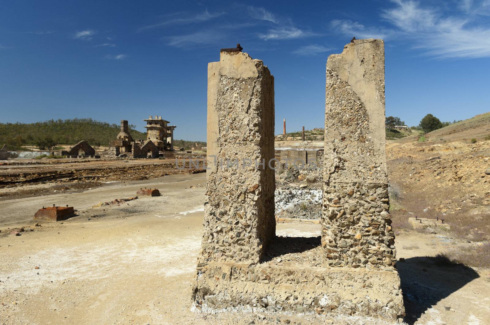 Damaged buildings in São Domingos Mine, a deserted open-pit mine in Mertola, Alentejo, Portugal. This site is one of the volcanogenic massive sulfide ore deposits in the Iberian Pyrite Belt, which extends from the southern Portugal into Spain