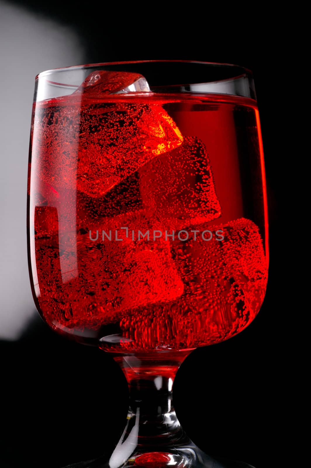 Glass of red drink with ice closeup (C1) by Laborer