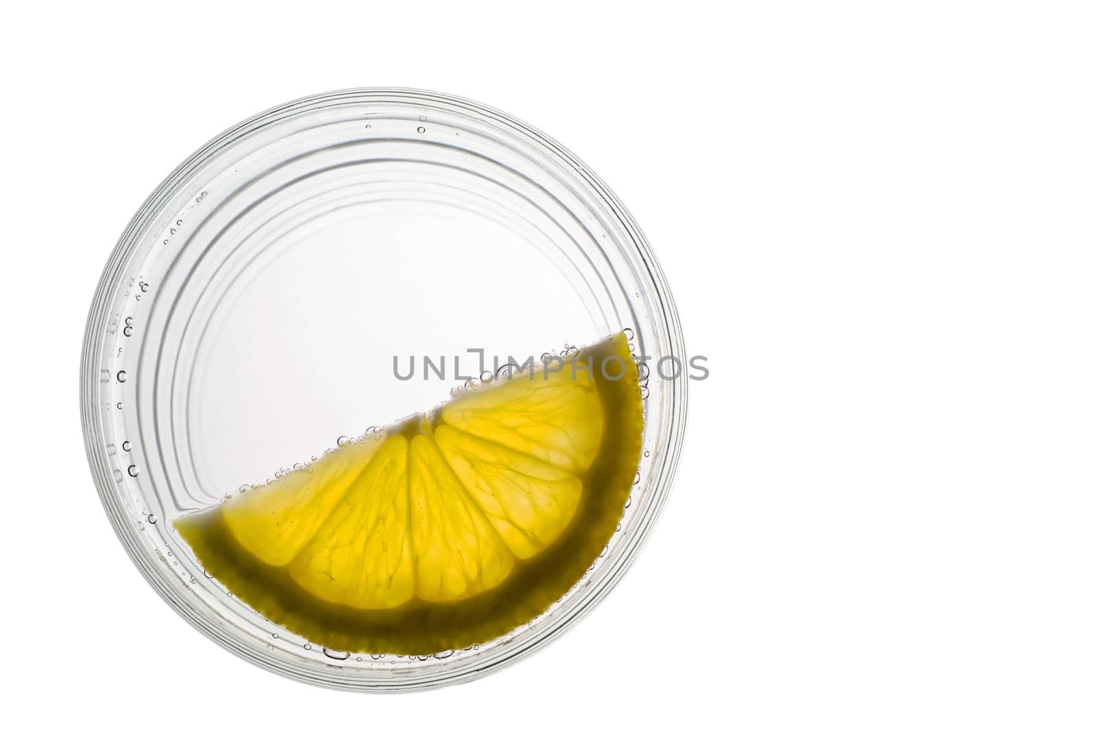 Glass of water  with lemon slice closeup (top) with clipping pat by Laborer