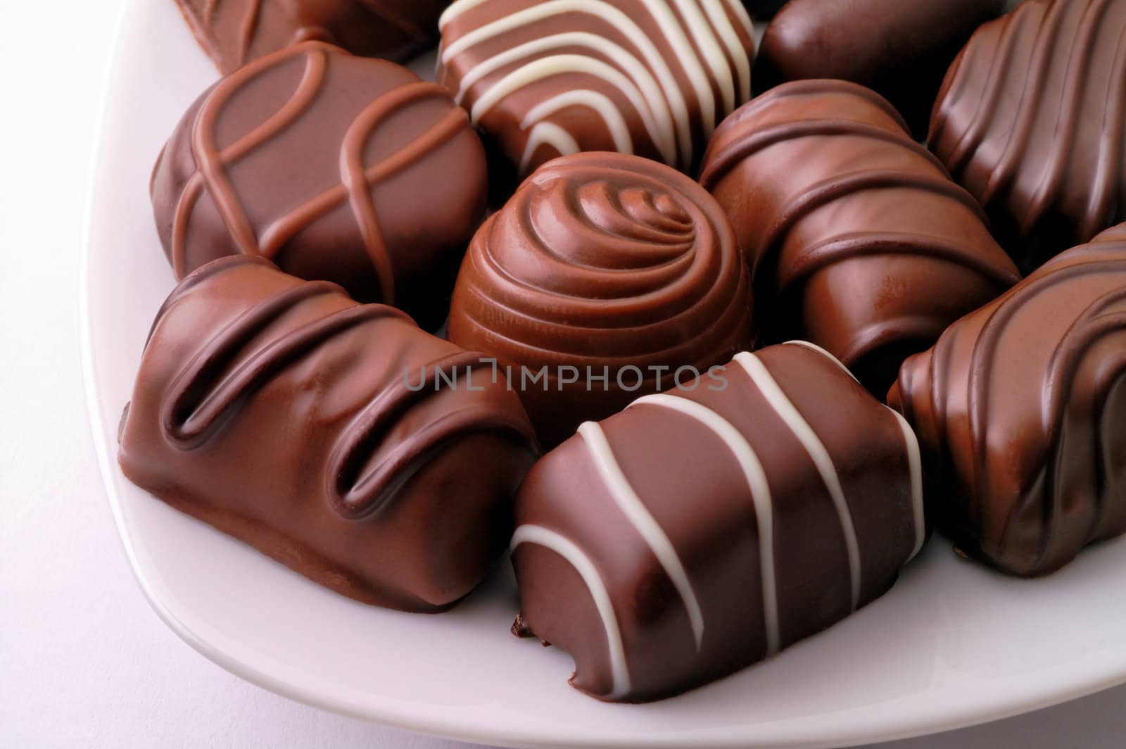 Chocolate candies in a dish by Laborer