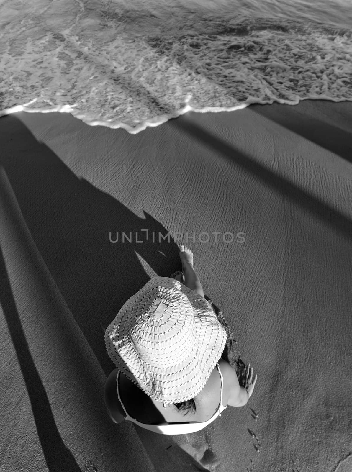 Woman sitting on the beach