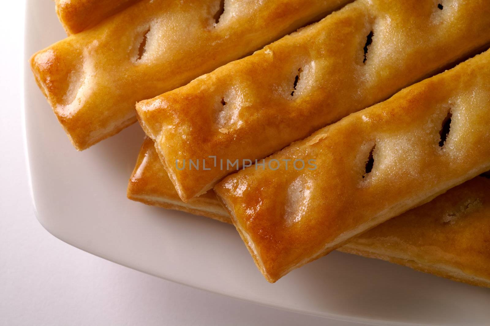 Glazed puff pastry in a dish  by Laborer