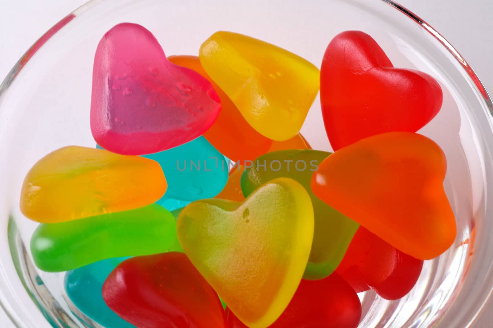 Heart shaped colored candies (Valentine)  in a glass bowl