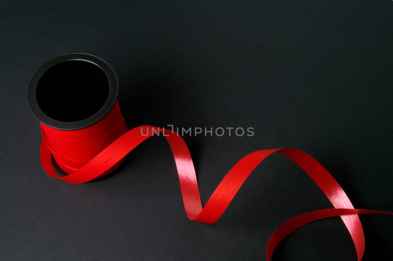 Red tape on black background by Laborer