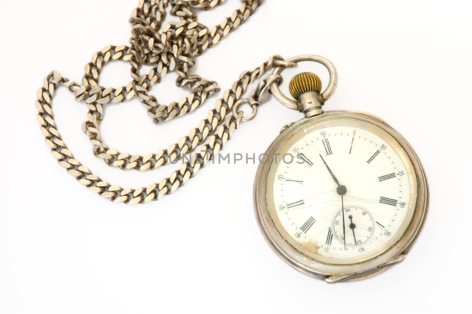 Old silver pocket watch with fob on overwhite background.