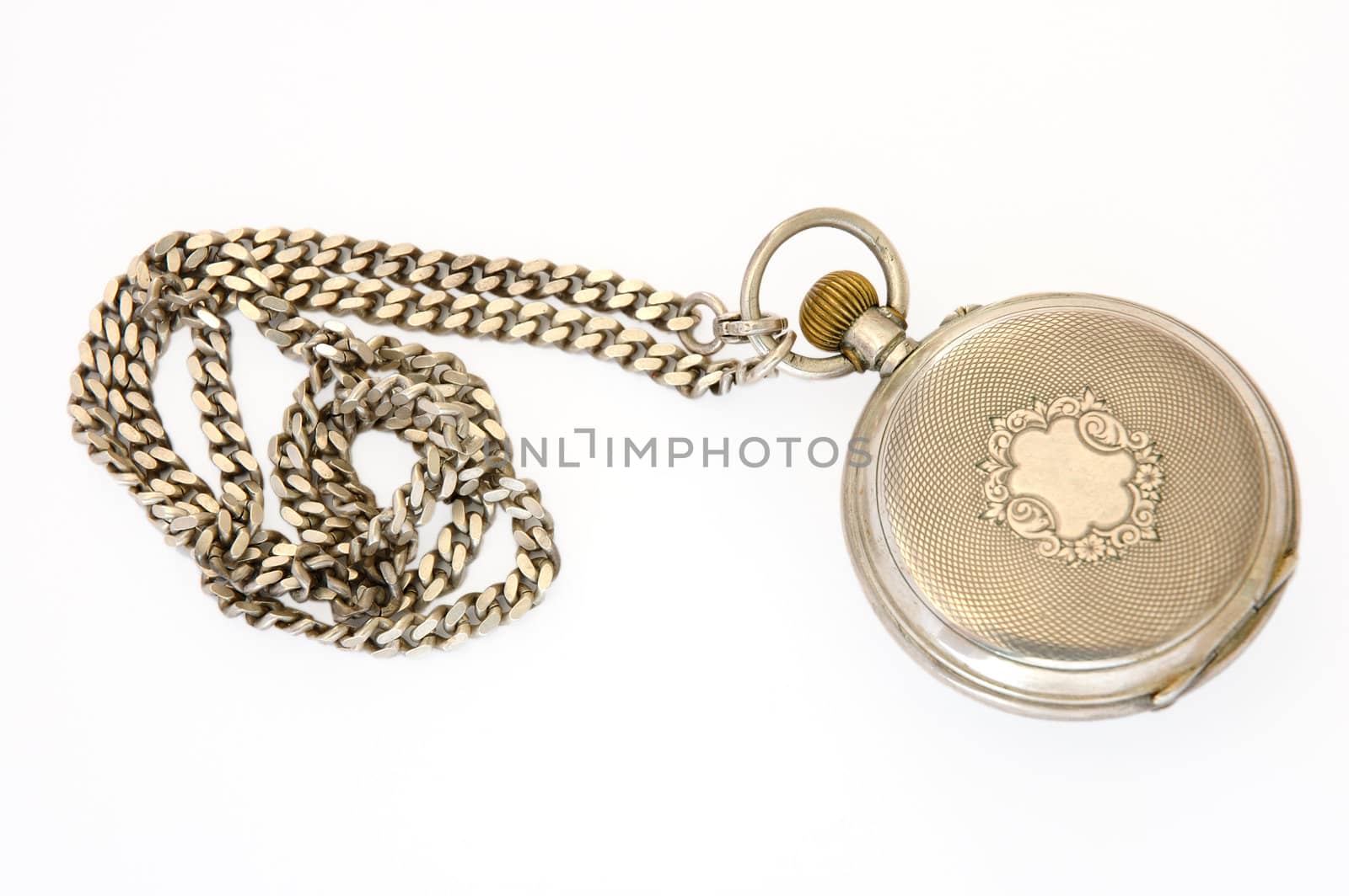 Old silver pocket watch (reverse or other side) with fob on overwhite background.