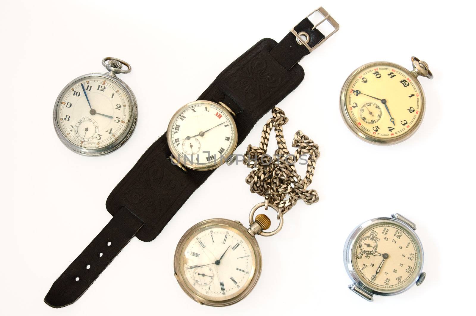 Many different old watches on overwhite background.