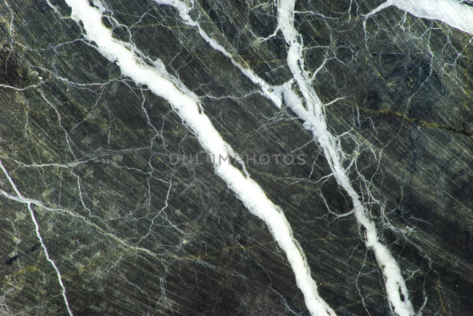 Green marble with white veins and a smattering of grey color