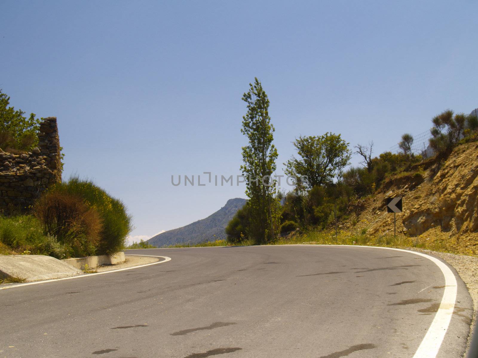 road in cretan mountains on a bright sunny day