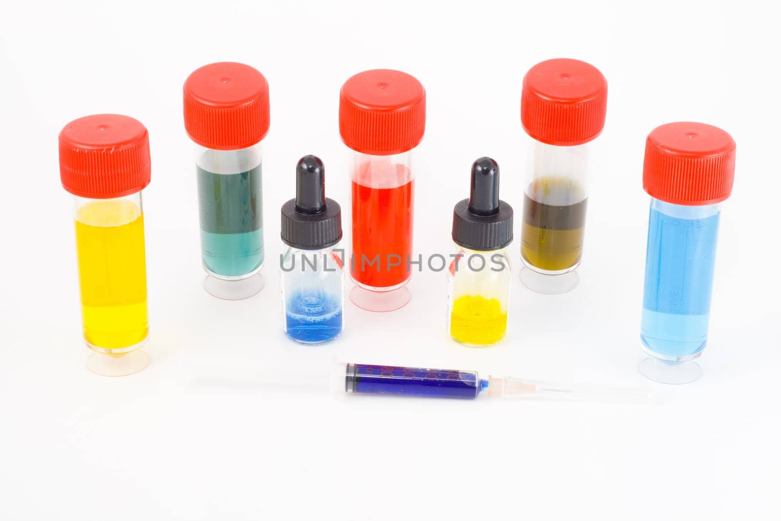 a set of five test tubes with colourful potions