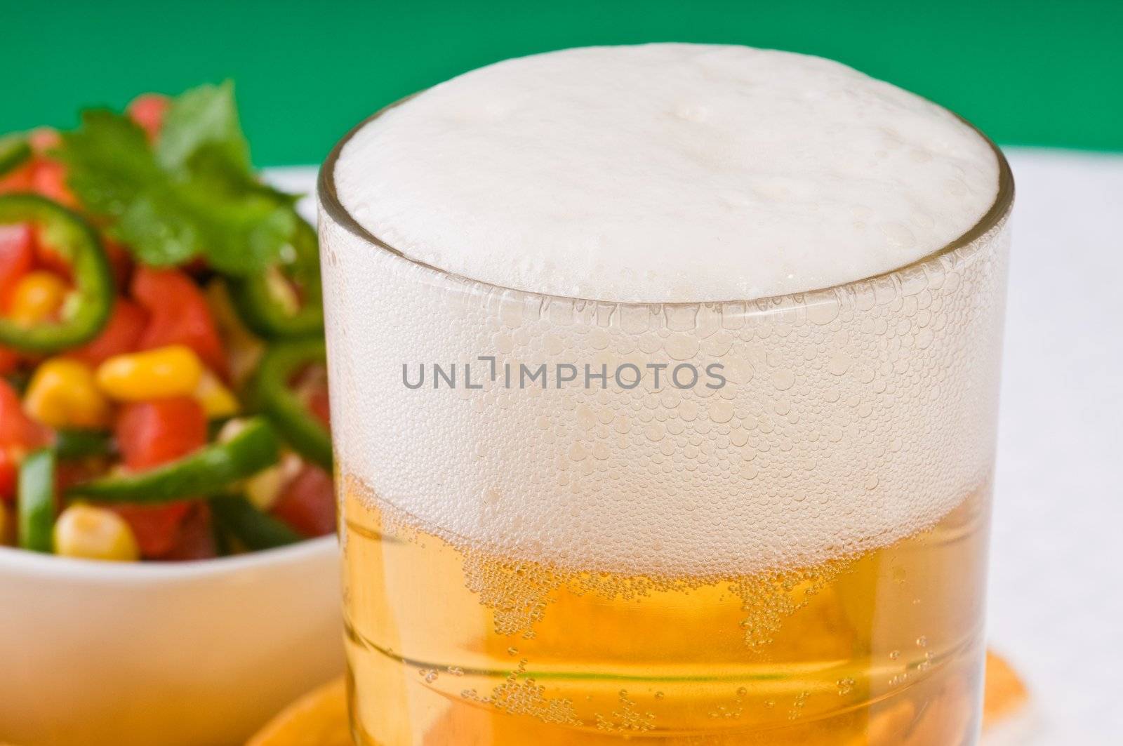 Closeup of a frosty glass of beer.