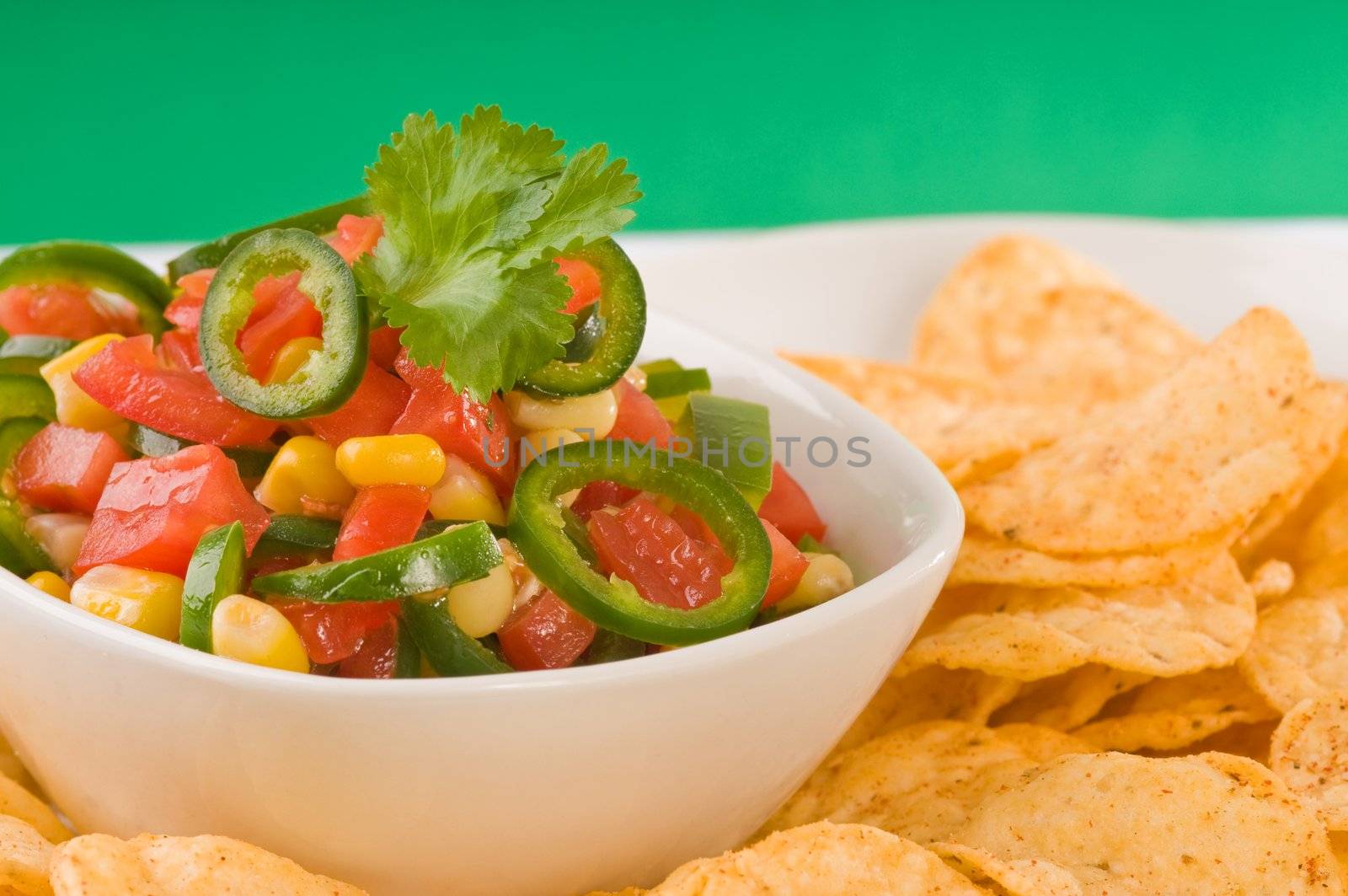 Closeup of a bowl of colorful delicious salsa.