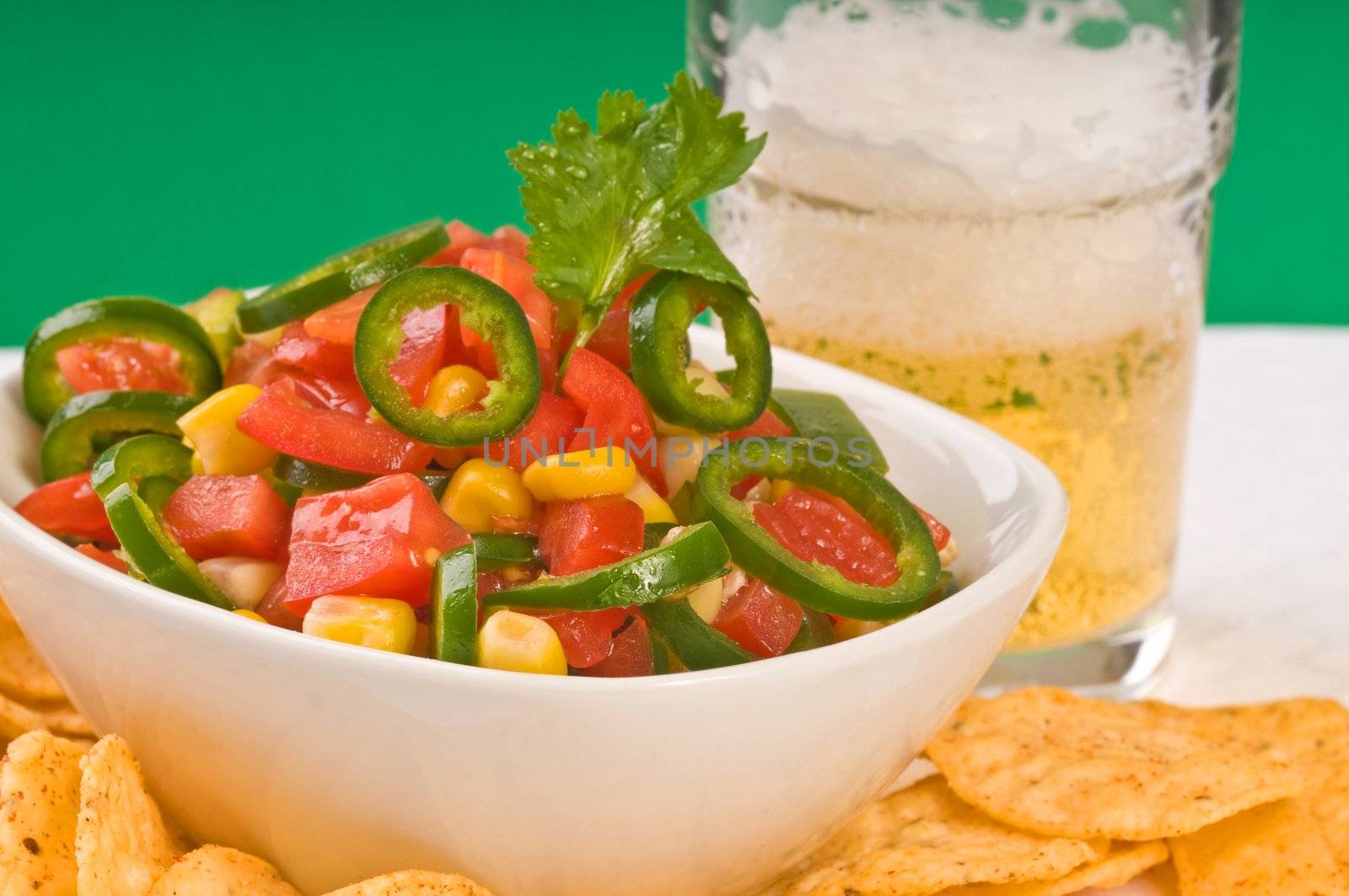 Delicious snack or homemade salsa and cold beer.