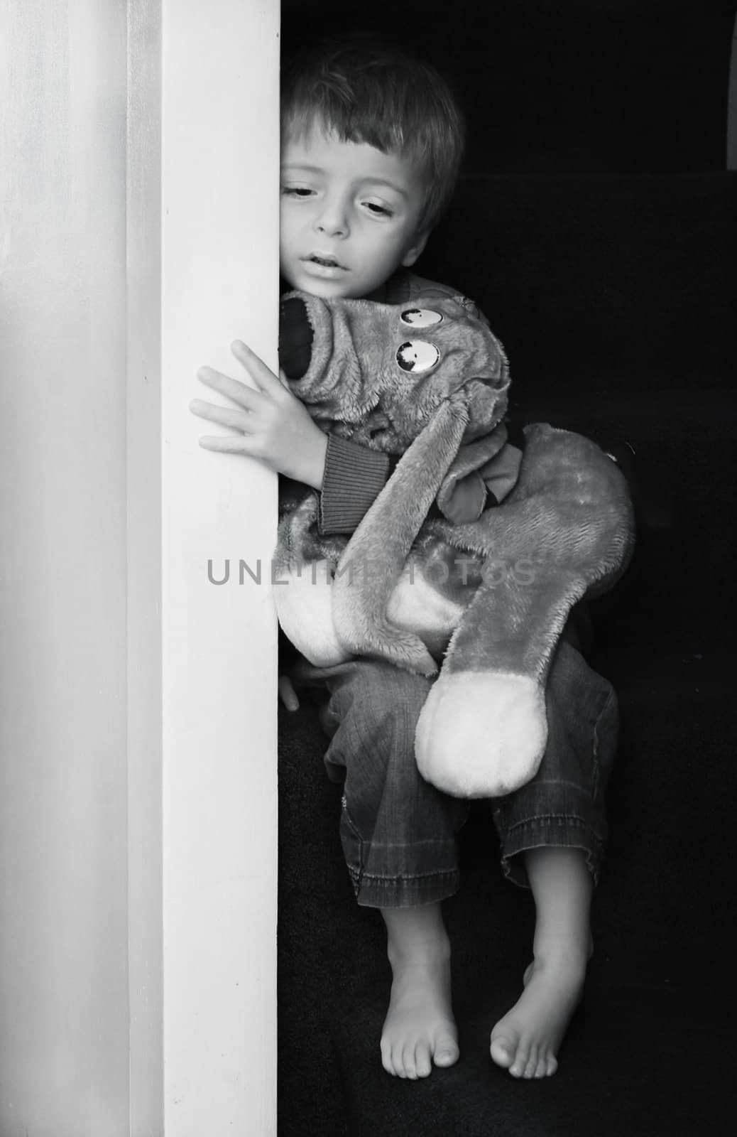 Impression of sad little boy in black and white.
