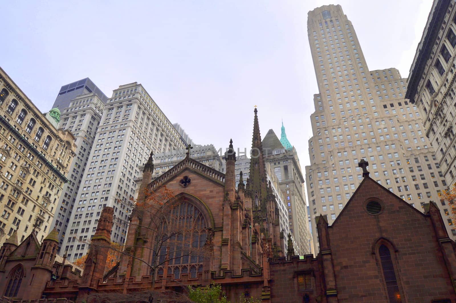 The trinity church among the skyscrapers in Lower Manhattan, New York.