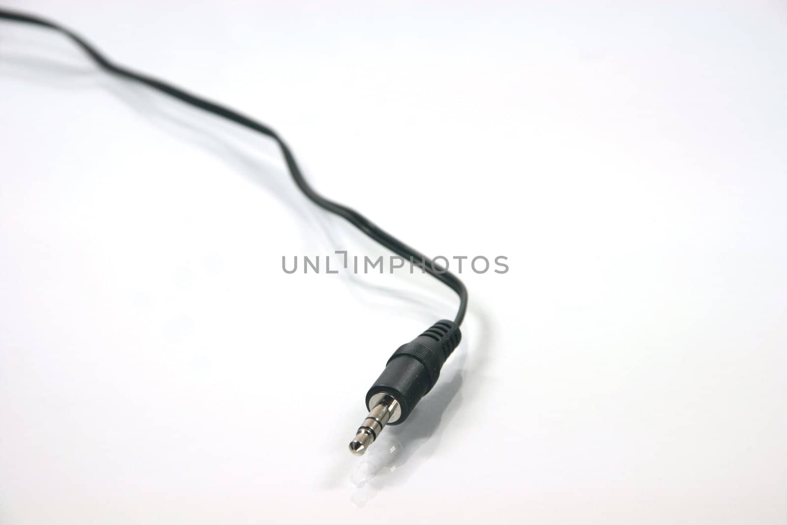 headphones plug with black cable in white background