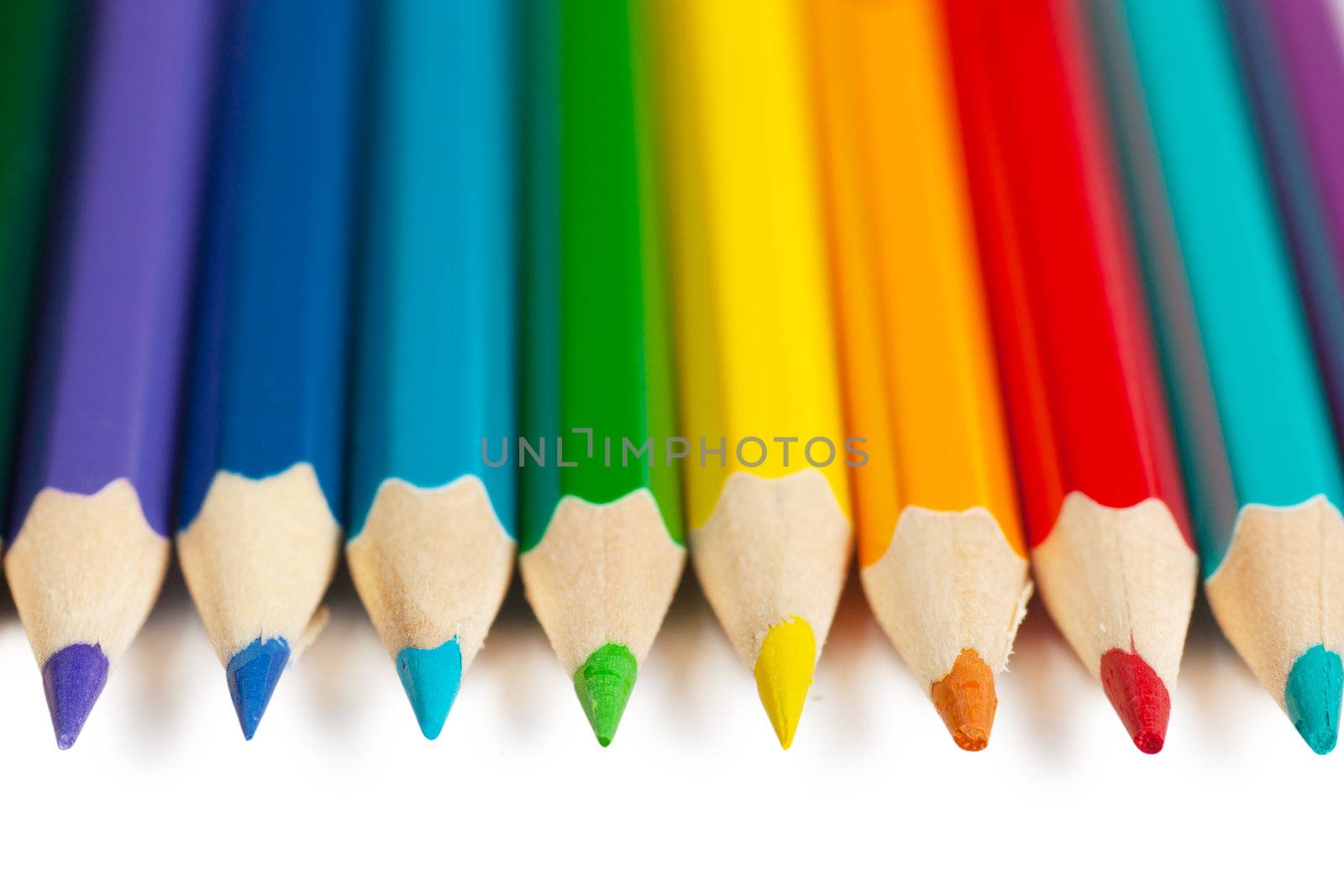 Colorful pencils over white background