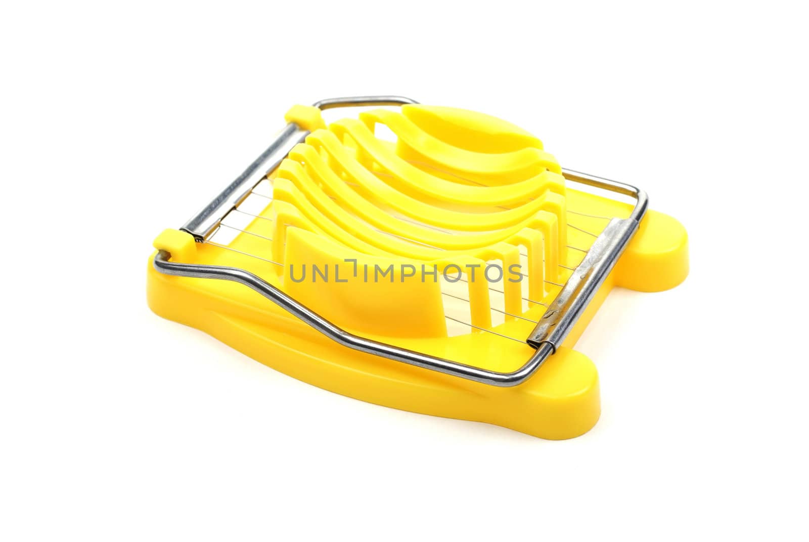 Yellow plastic egg cutter isolated on white background. Studio shot.