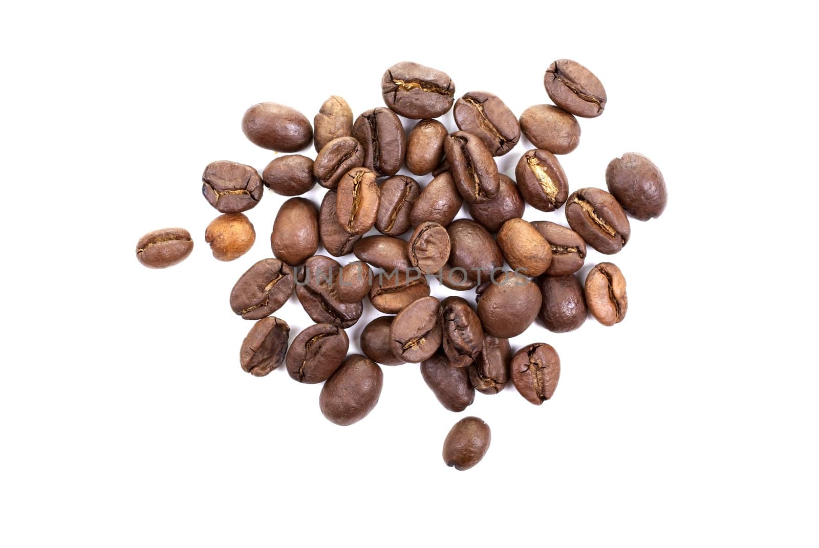 Heap of brown roasted coffee beans isolated on white background.