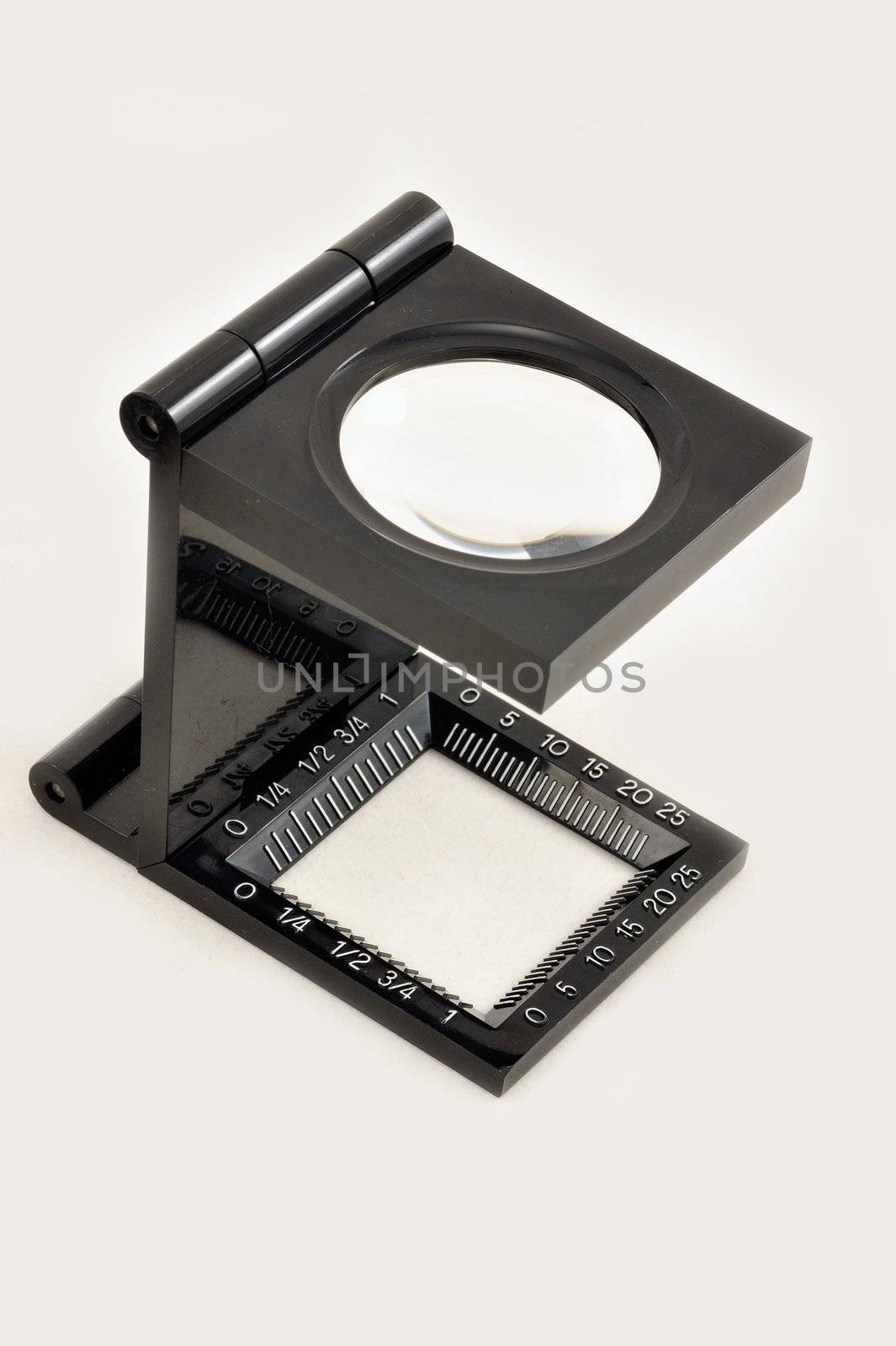 Isolated magnifying glass on white background.