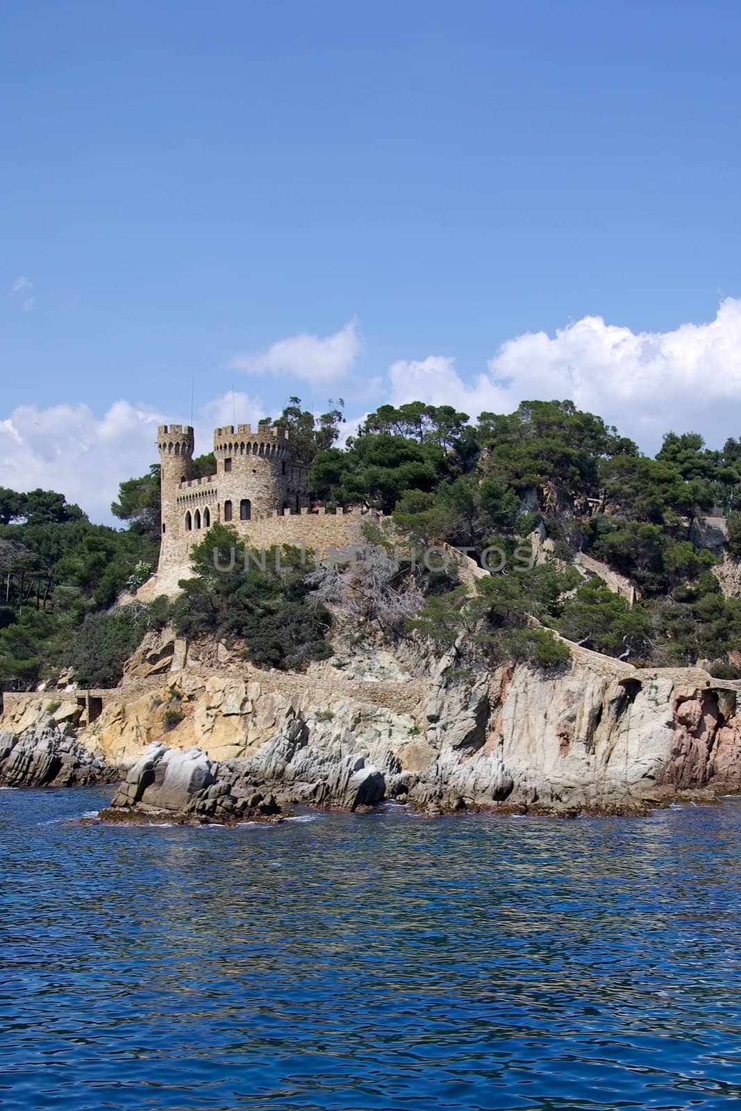 Landscape with castle view from sea in Lloret de Mar, Costa Brava, Spain. 