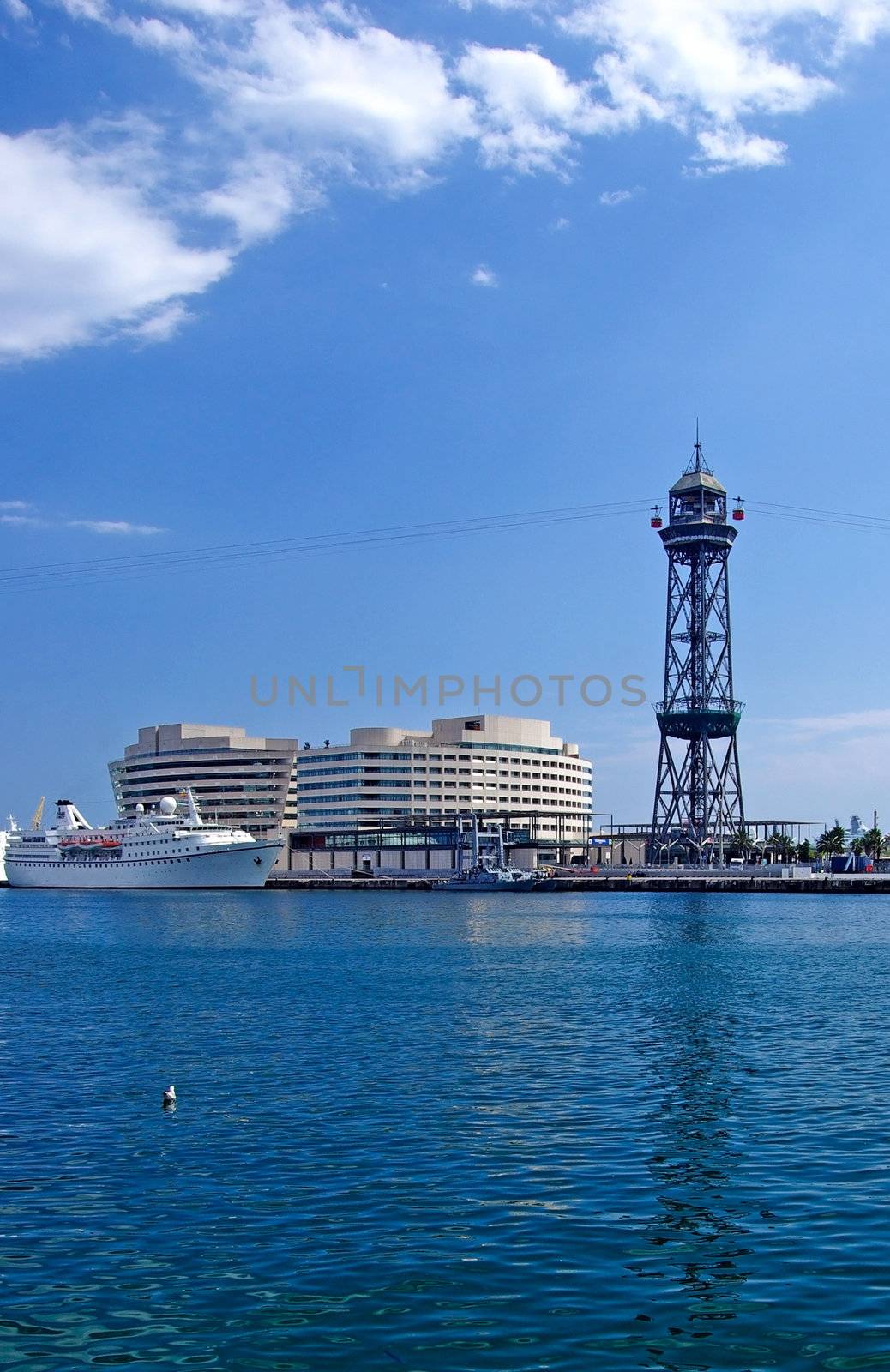 Cityscape of Barcelona harbour with ropeway. Spain, Europe. by borodaev