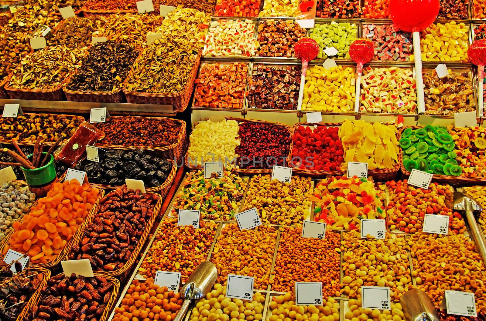 Abundance of nuts, fruits, sweet things at Barcelona market.