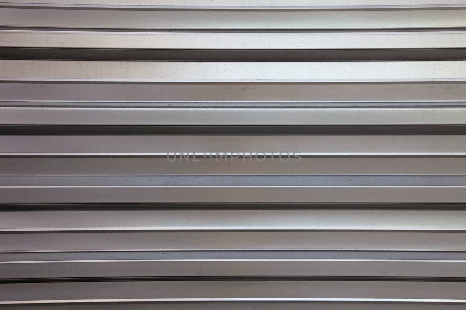Abstract lined aluminium wall as backdrop or background.