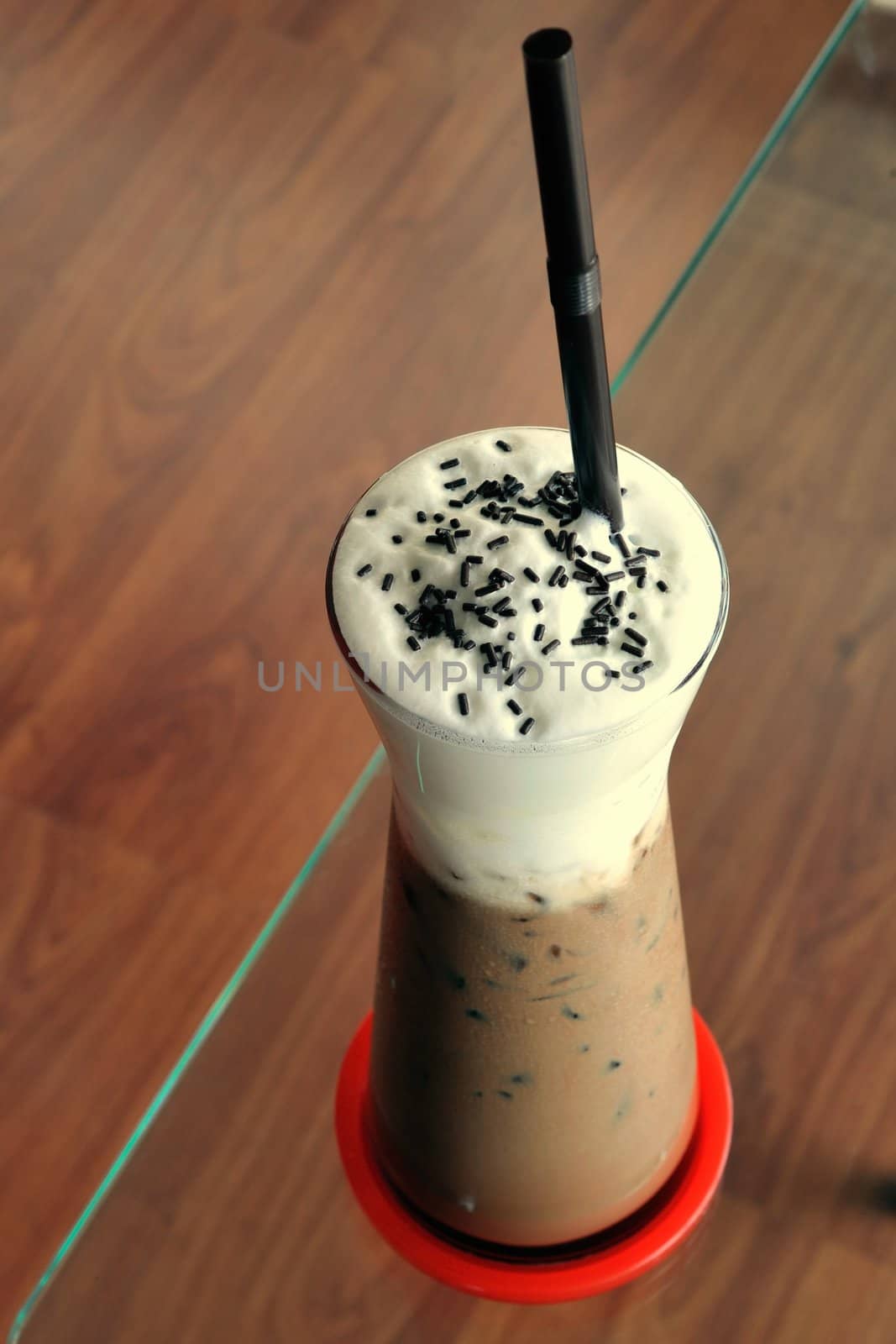 Cold fresh ice coffee with chocolate closeup.