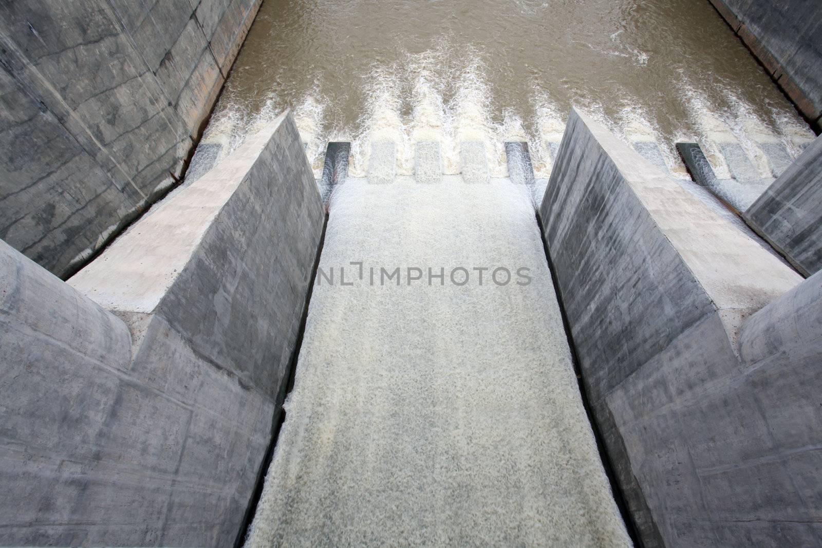 Water pouring through the water gates at dam