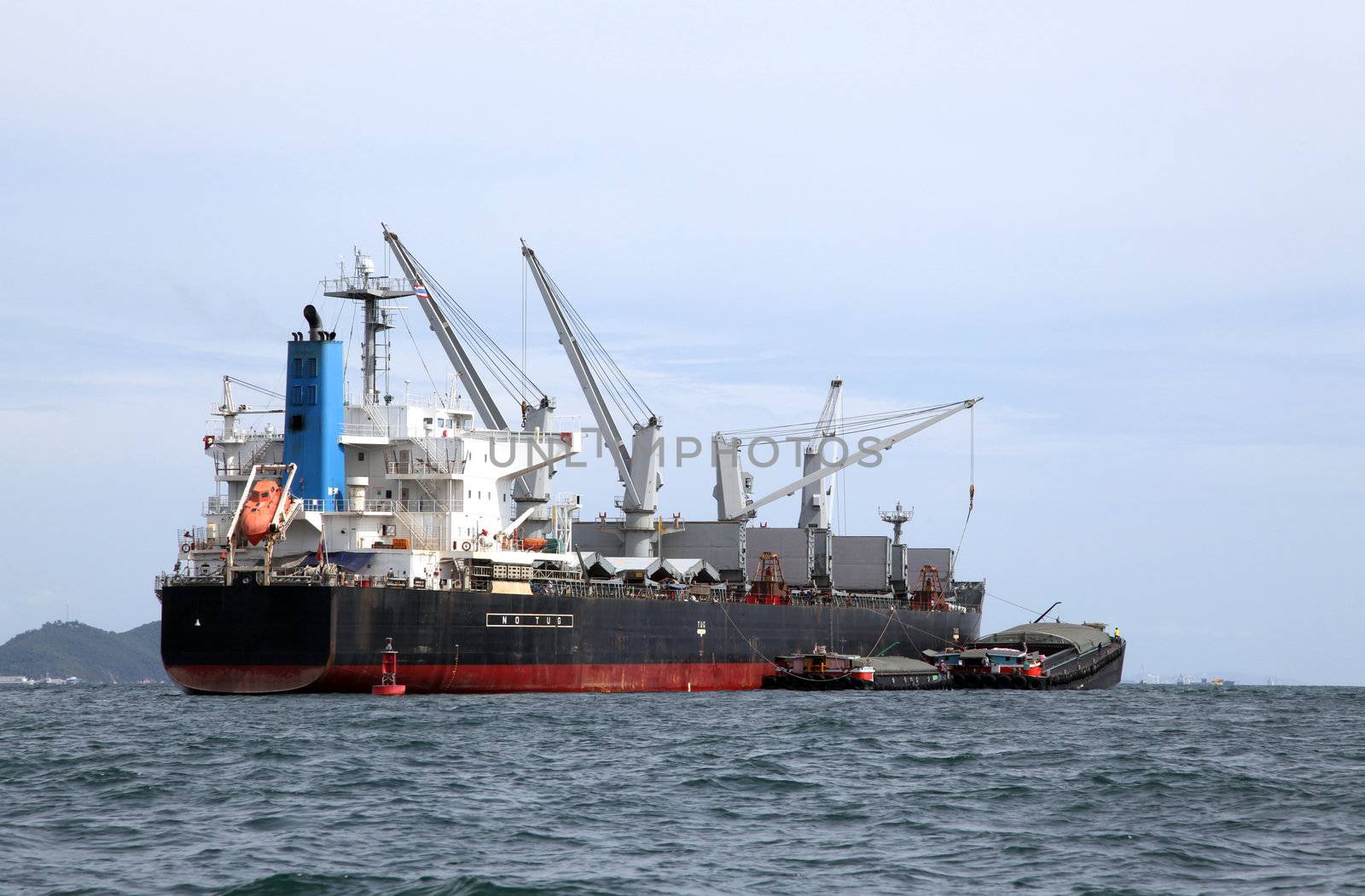 cargo liner freight Ship with containers and tug ship