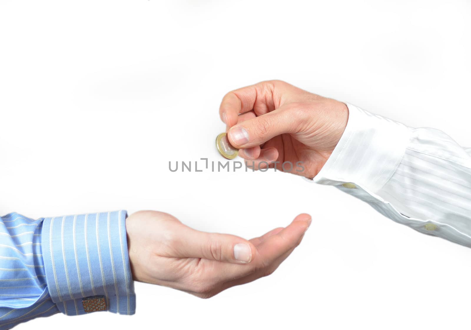 Hand gives or donates a 1 euro coin to another hand. Isolated on white