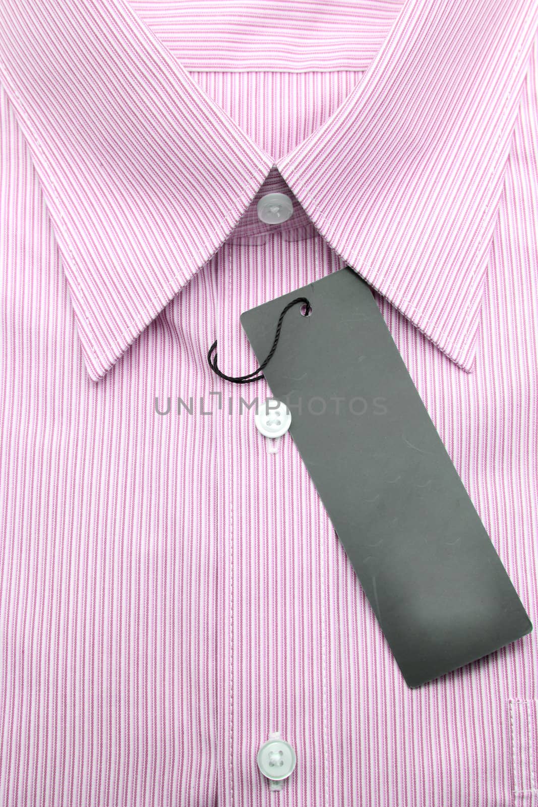 Close up view of a generic line pattern red business shirt with a blank label