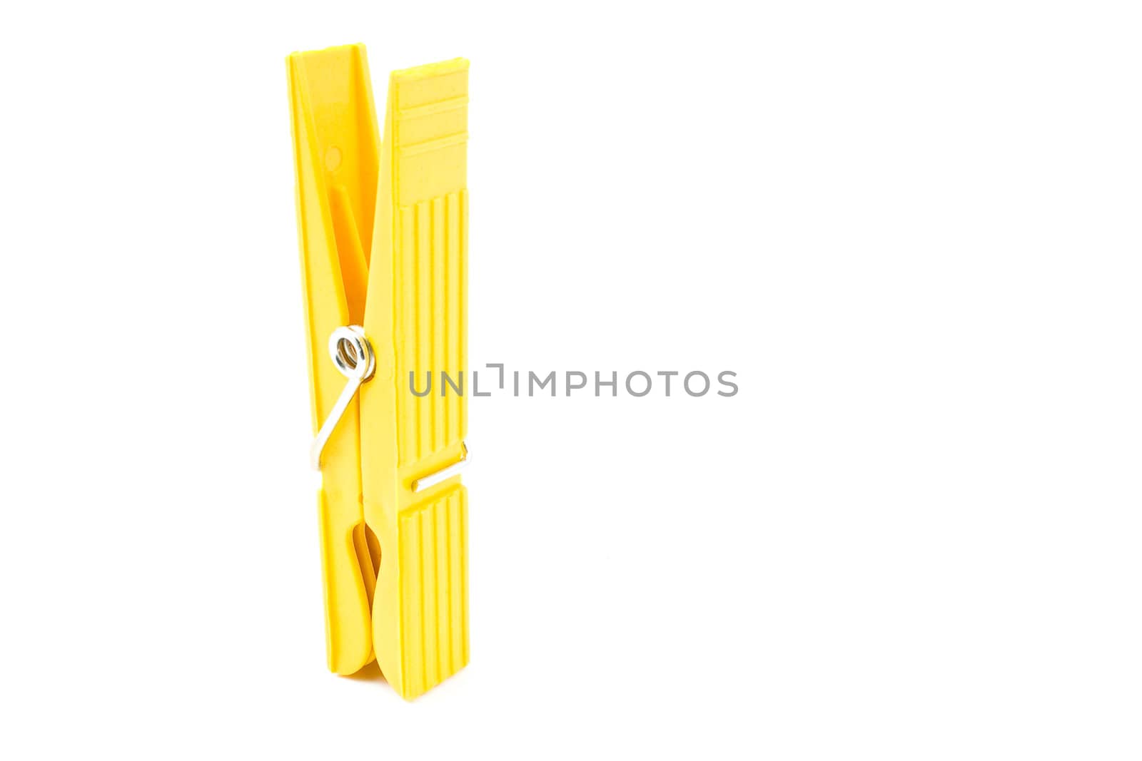 Yellow Clothespin isolated on white