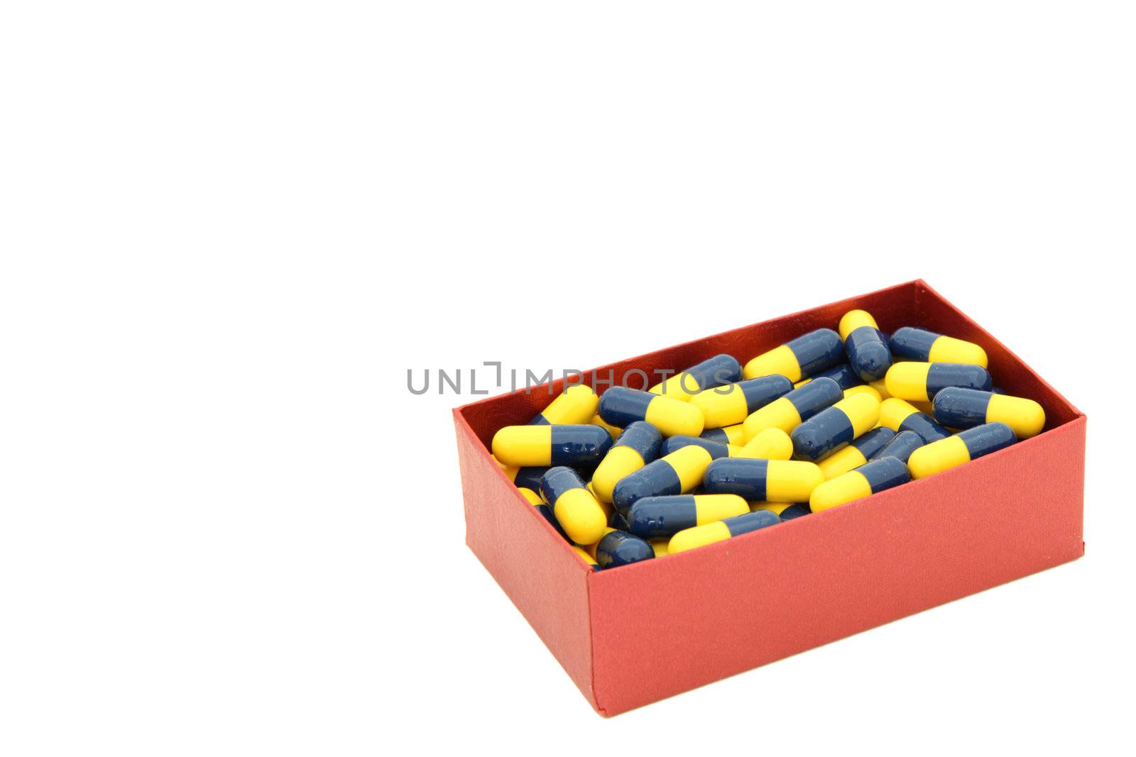yellow blue capsules in red box