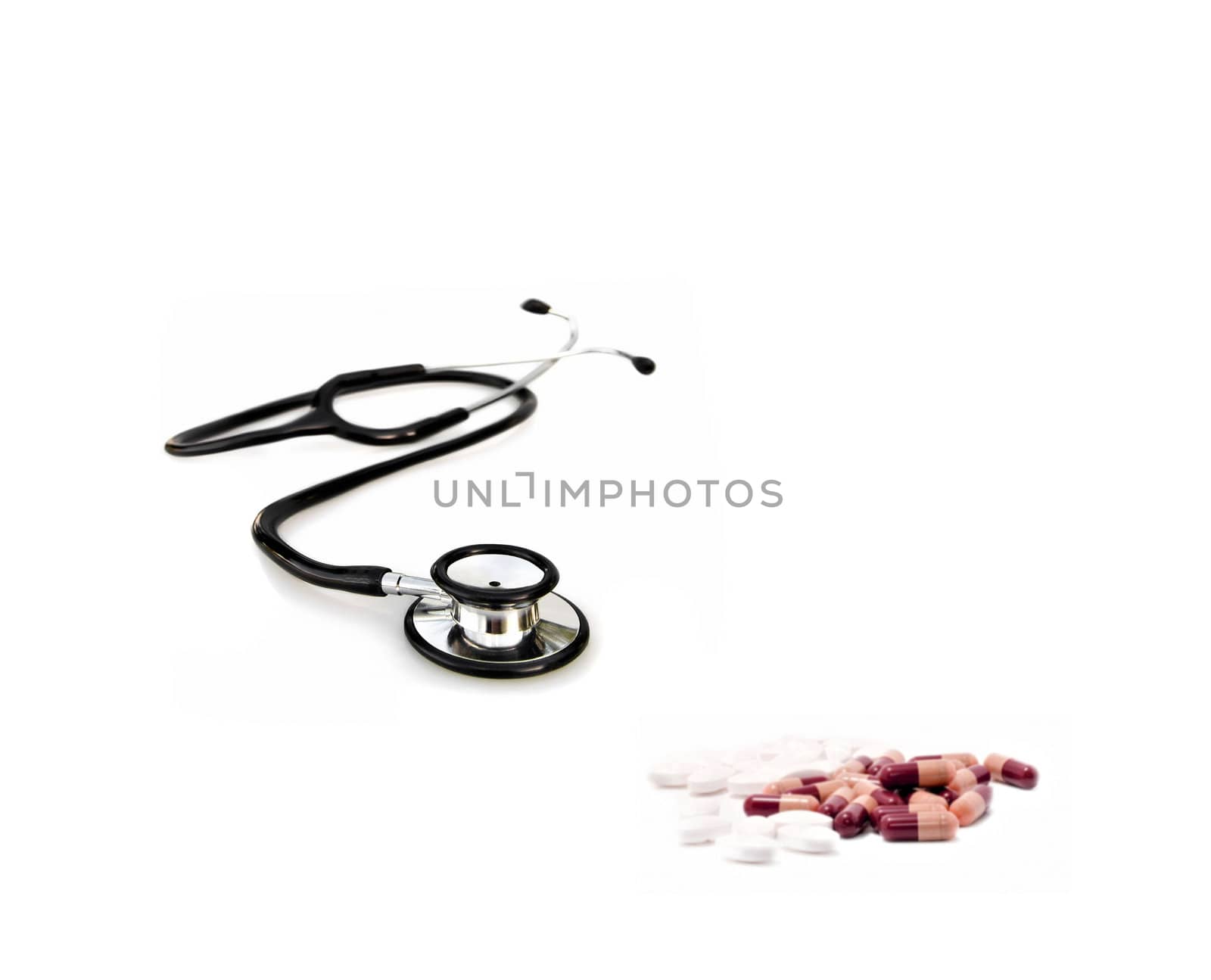 doctors stethoscope with pills