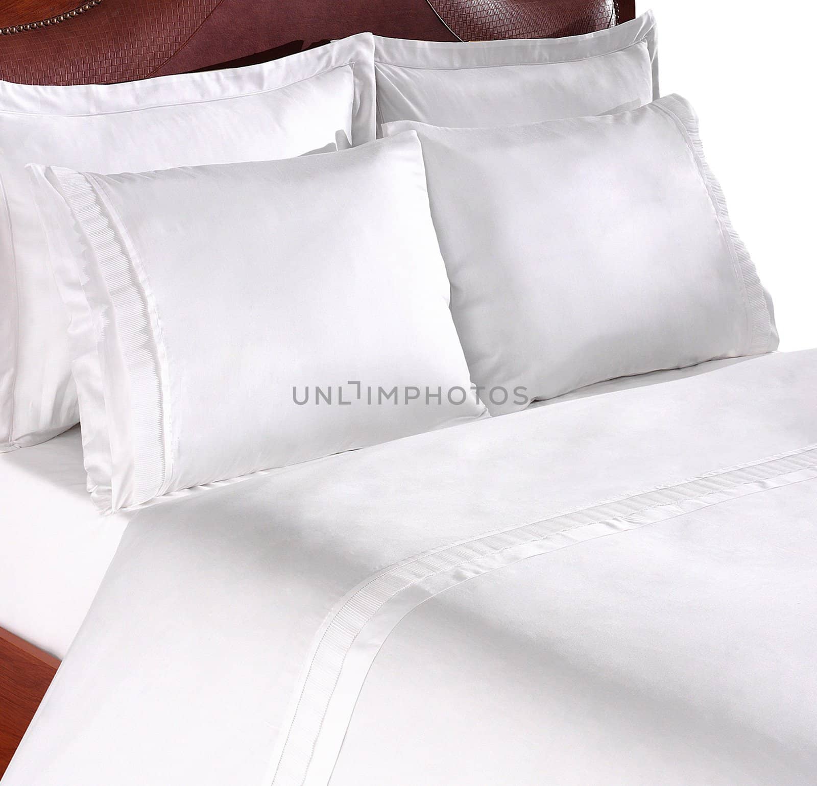 close up picture of two pillows on a sofa