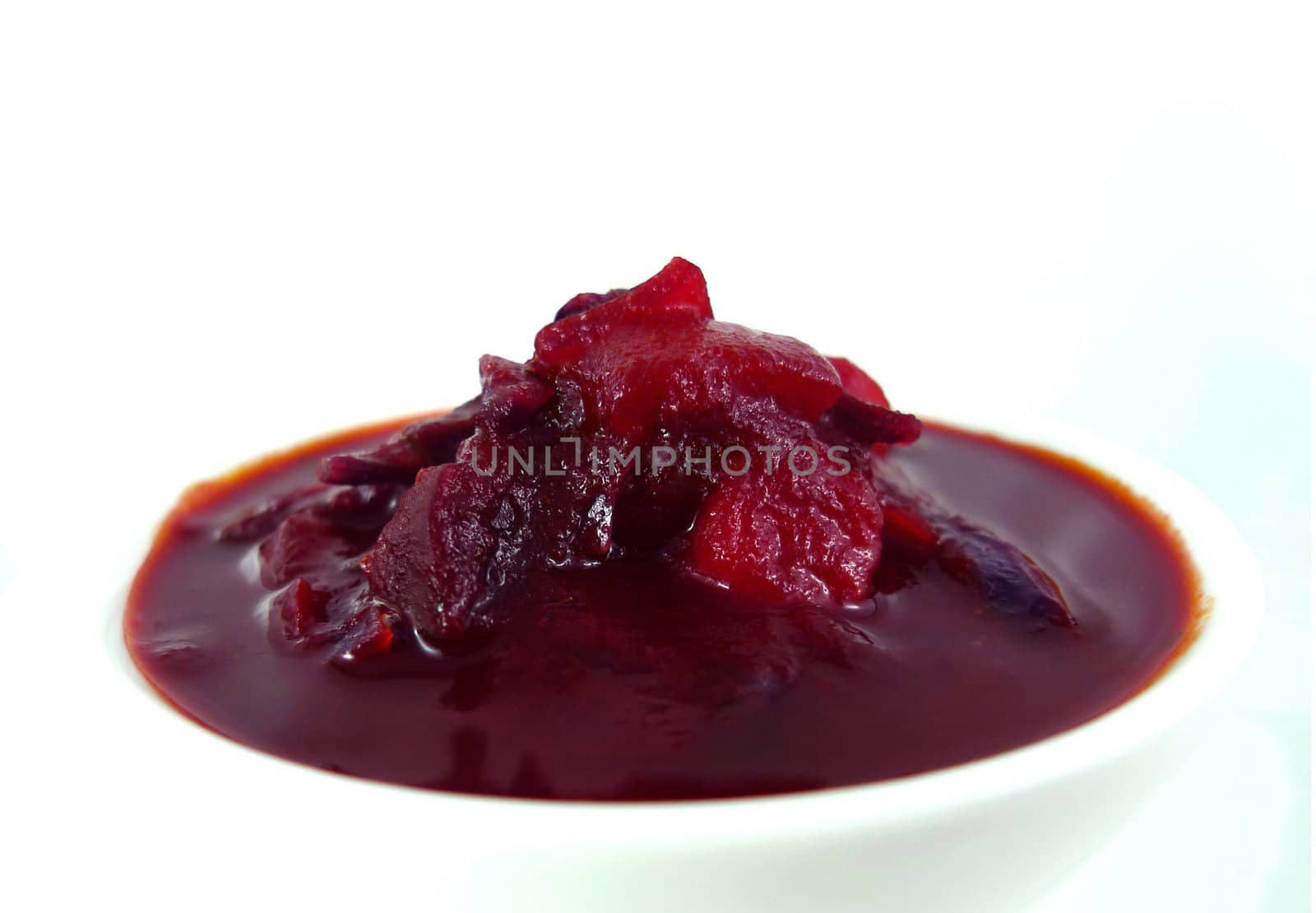Red soup isolated on a white background