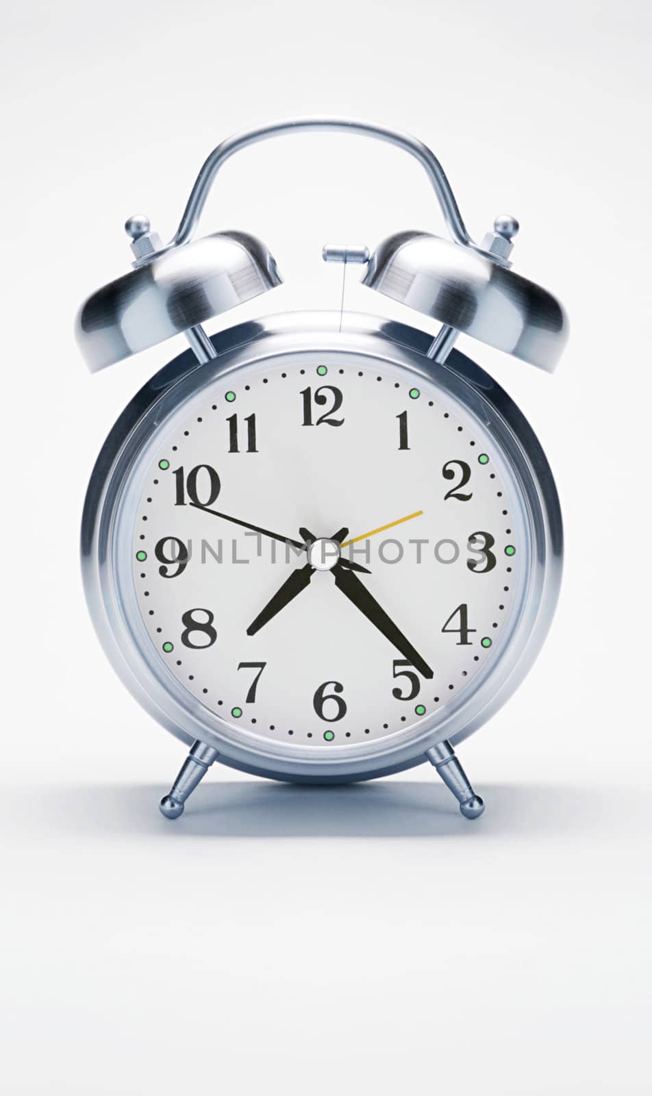 Metal alarm clock isolated on white by ozaiachin